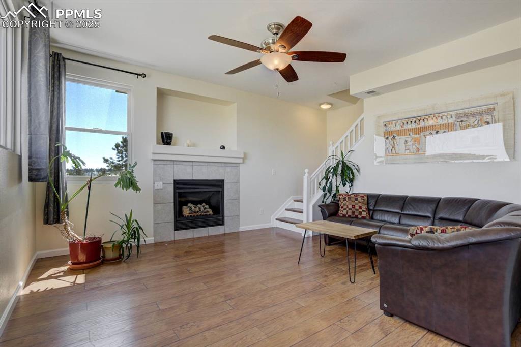 Image 16 of 50: Main level living room with a gas fireplace