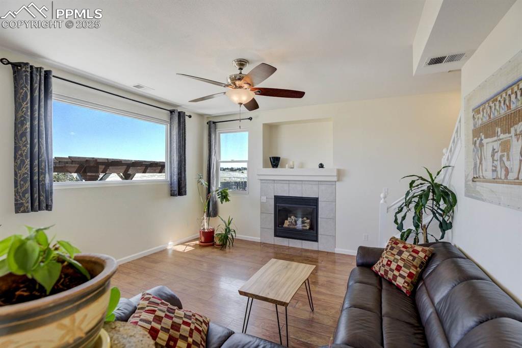 Image 17 of 50: Living room with back yard views
