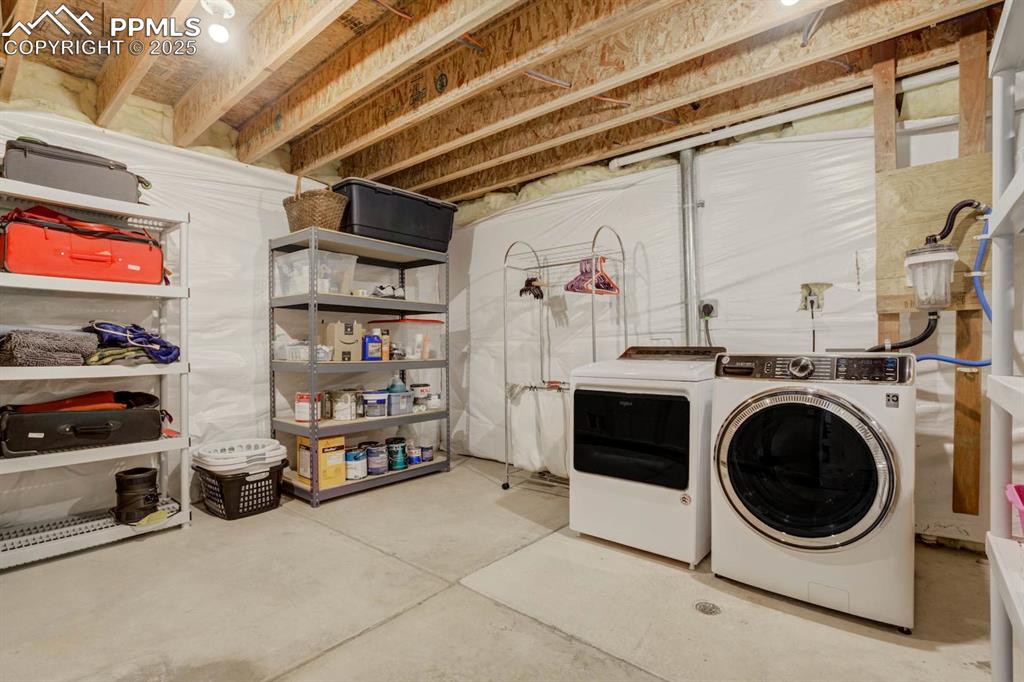 Image 34 of 50: Large Laundry room with oversized washer and dryer included