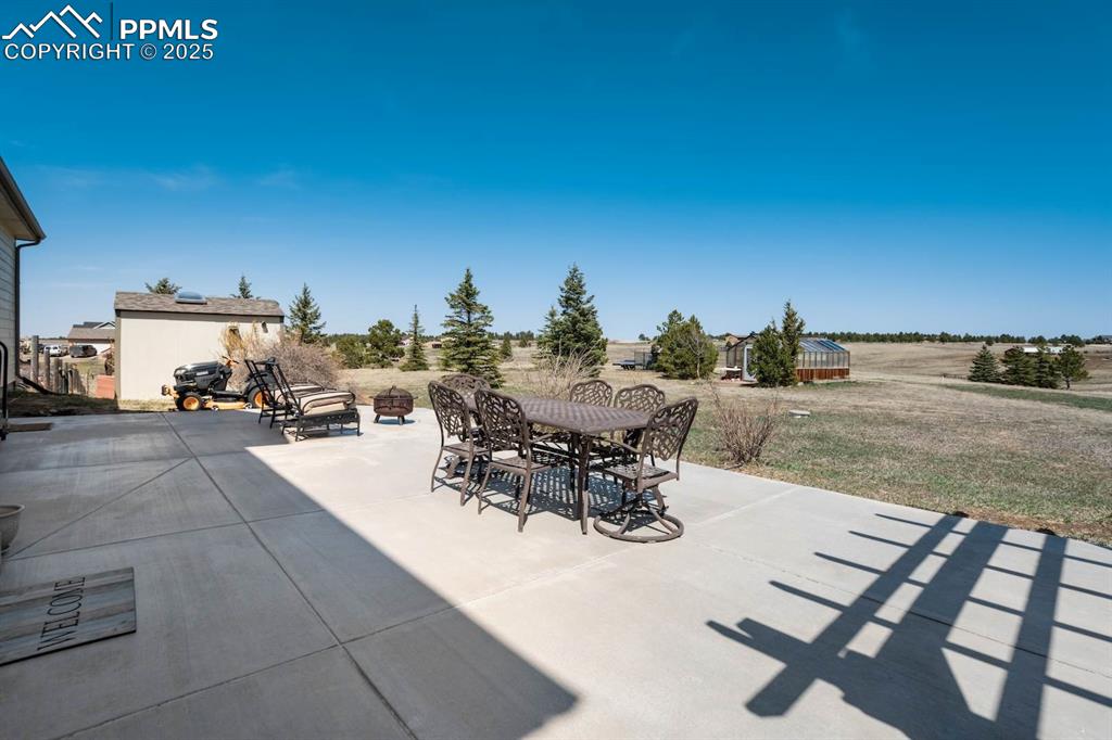 Image 35 of 50: Large back patio with plenty of space for outdoor entertainment