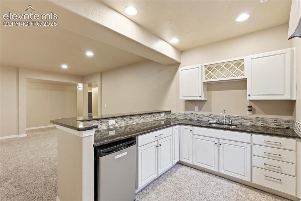 Image 36 of 50: Basement Wet Bar