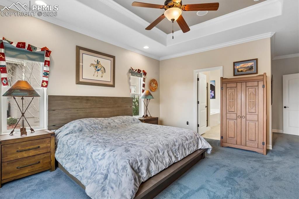 Image 18 of 48: Bedroom featuring ornamental molding, dark colored carpet, recessed lightin