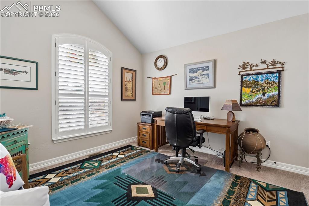 Image 23 of 48: Laundry room with light colored carpet, washing machine and clothes dryer,