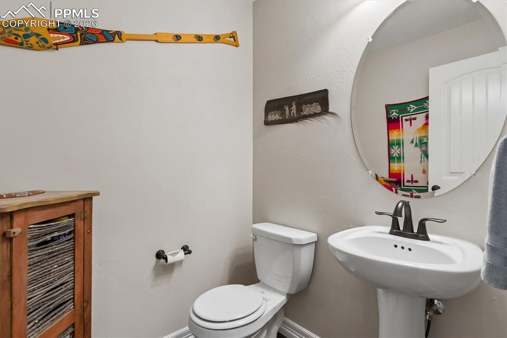 Image 25 of 48: Home office featuring lofted ceiling and baseboards