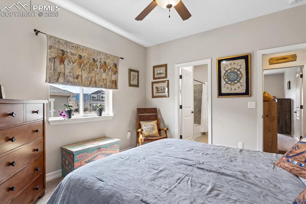 Image 27 of 48: Carpeted bedroom with a closet and ceiling fan