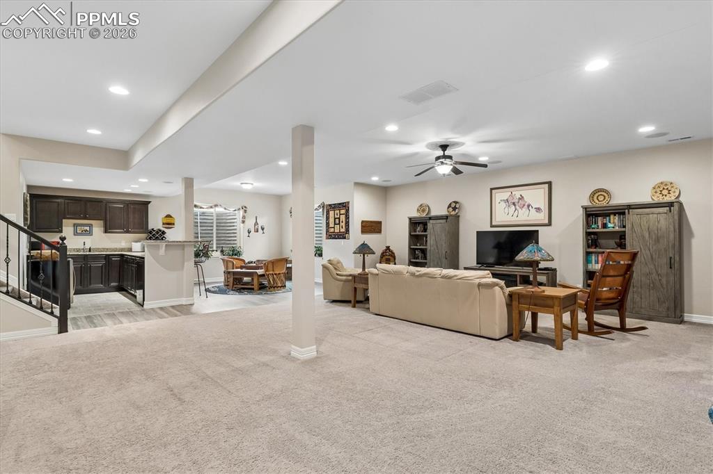 Image 30 of 48: Bedroom featuring light colored carpet and baseboards