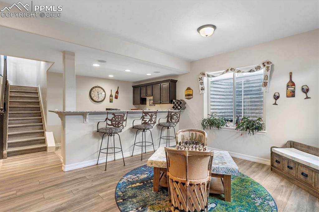Image 34 of 48: Living area featuring light colored carpet, a ceiling fan, and recessed lig