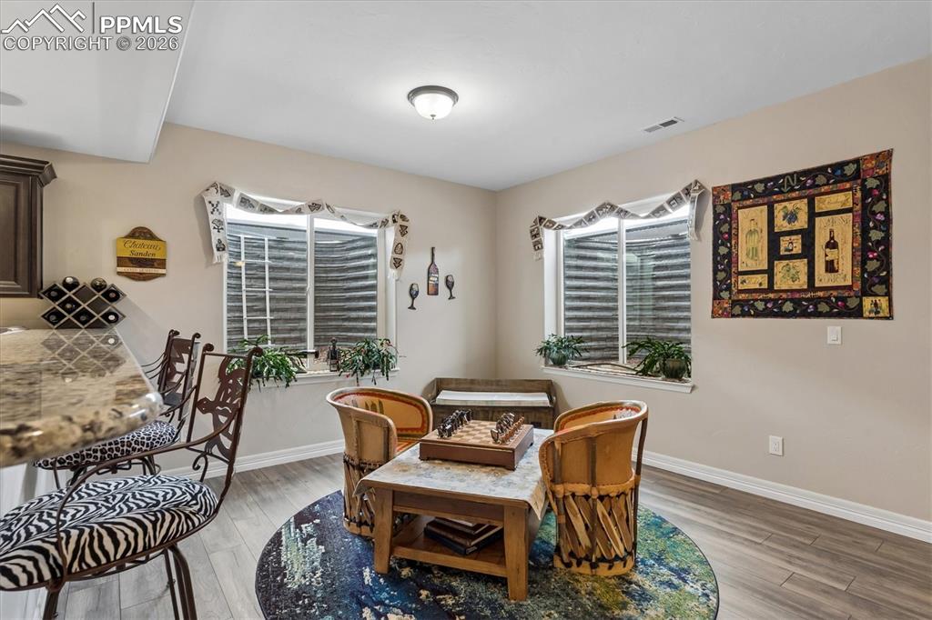 Image 35 of 48: Dining room featuring light wood-style floors and recessed lighting