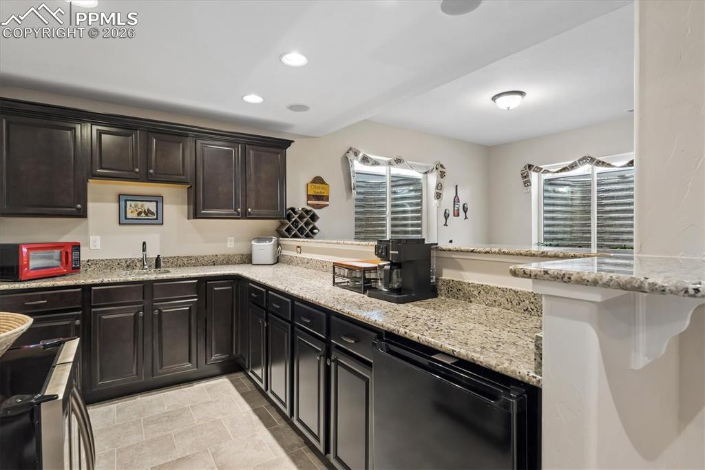 Image 36 of 48: Dining room with light wood-style flooring and baseboards
