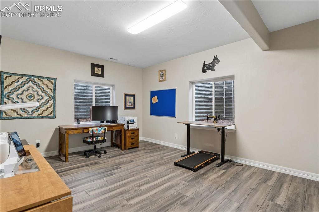 Image 38 of 48: Kitchen with stainless steel appliances, light stone countertops, stone fin