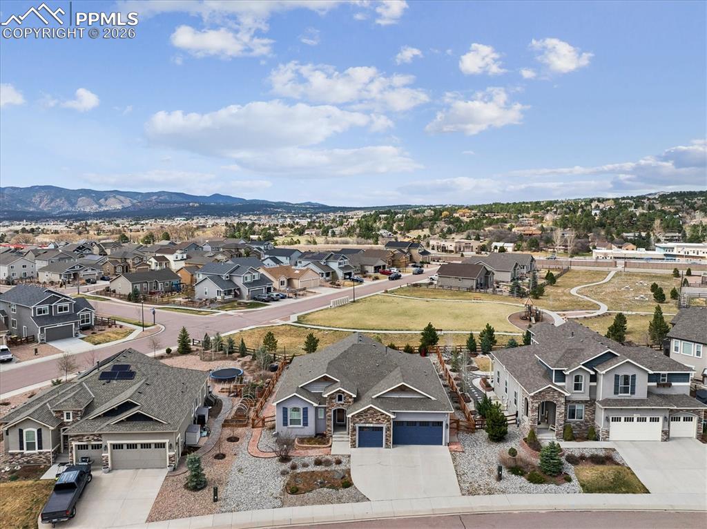 Image 4 of 48: Craftsman inspired home featuring stone siding, a garage, concrete driveway