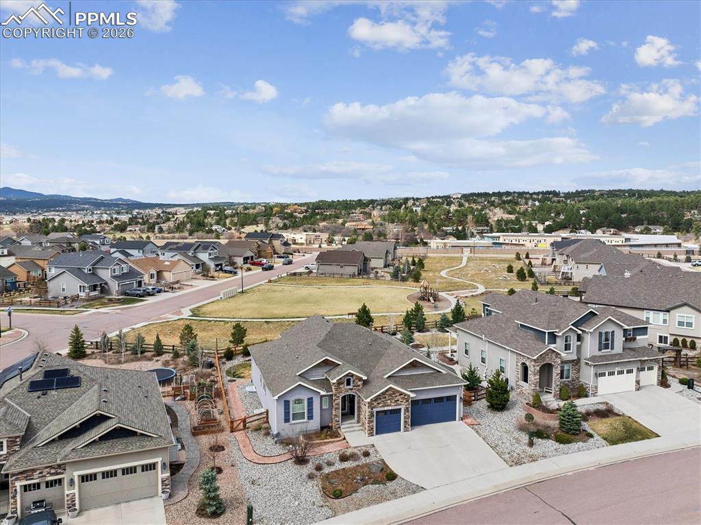 Image 5 of 48: Aerial perspective of suburban area with mountains