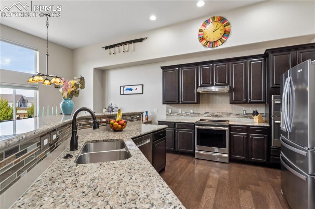 Image 7 of 48: Aerial view of residential area featuring mountains