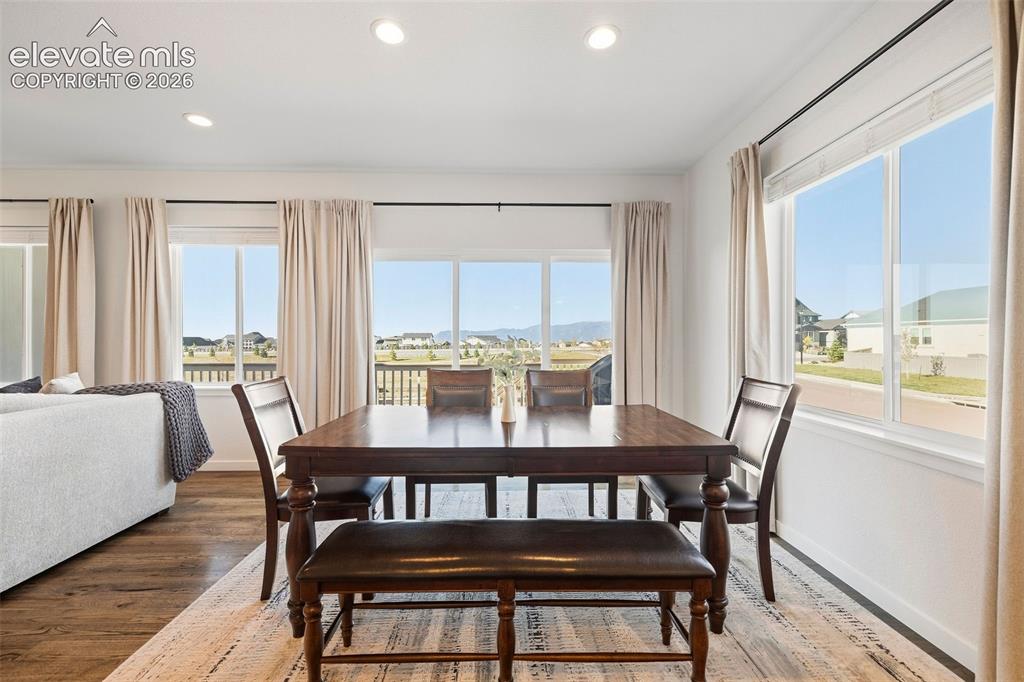 Image 10 of 46: Windows surround the dining area and make for fantastic views whether you