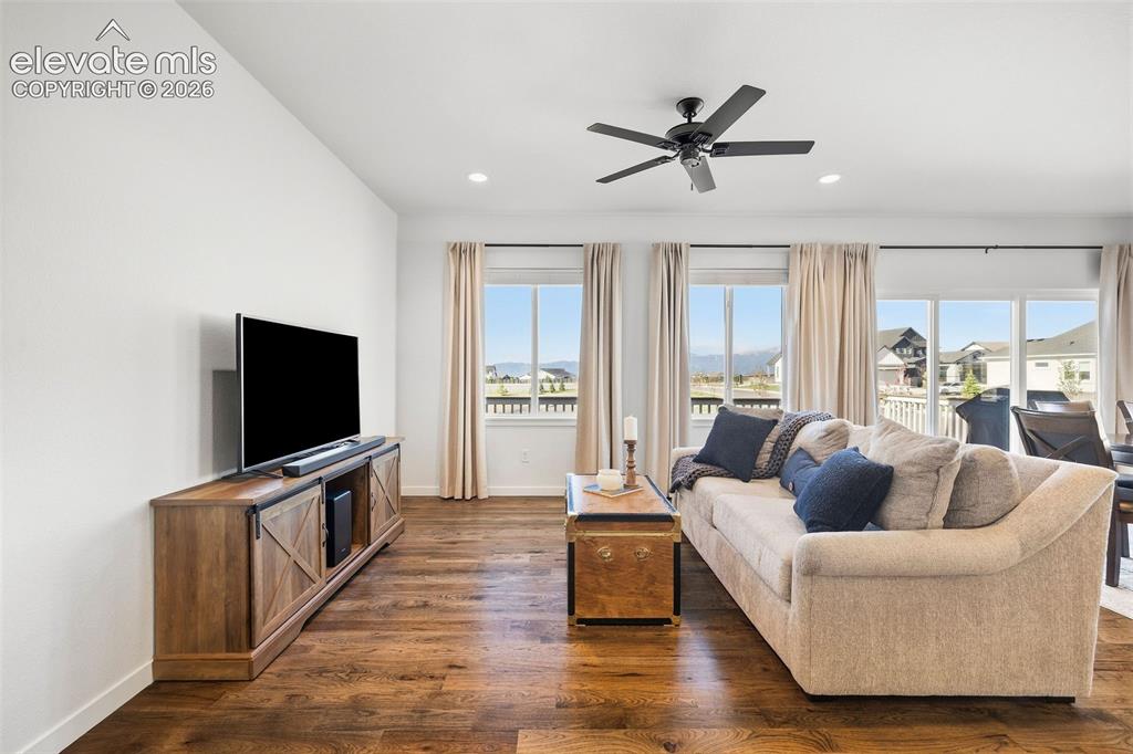 Image 12 of 46: This living room is all about the views! Real wood hardwood flooring and ac