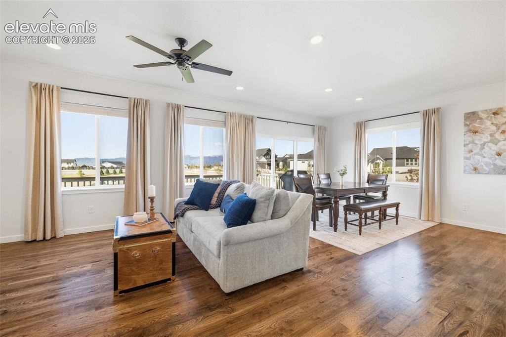 Image 2 of 46: The living room showcases the gorgeous Front Range views. It