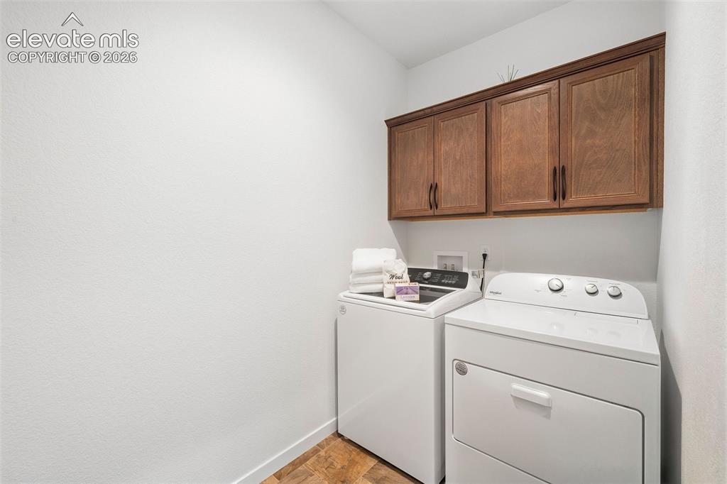 Image 24 of 46: The main-level laundry room is generously sized. 