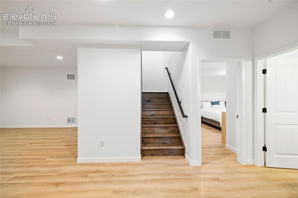 Image 26 of 46: Spread out and have fun! The lower-level family room has LVP floors and ple