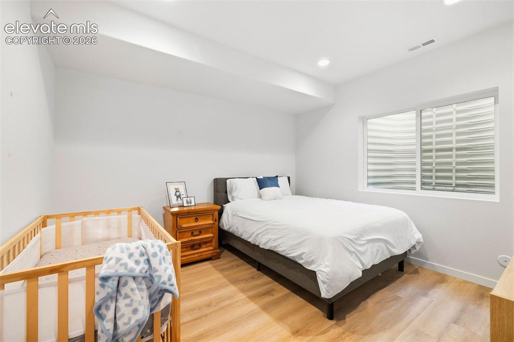 Image 29 of 46: The third bedroom on the lower level is perfect for the light sleeper who n