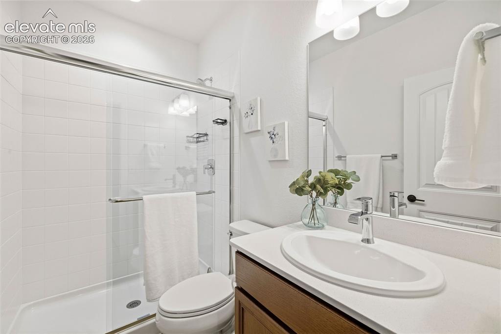 Image 31 of 46: This 3/4 bath on the basement level serves both bedrooms and the family roo