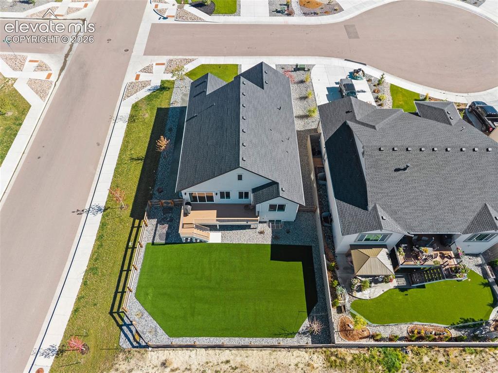 Image 39 of 46: Aerial view of back of the property. Not a leaf out of place. This home is