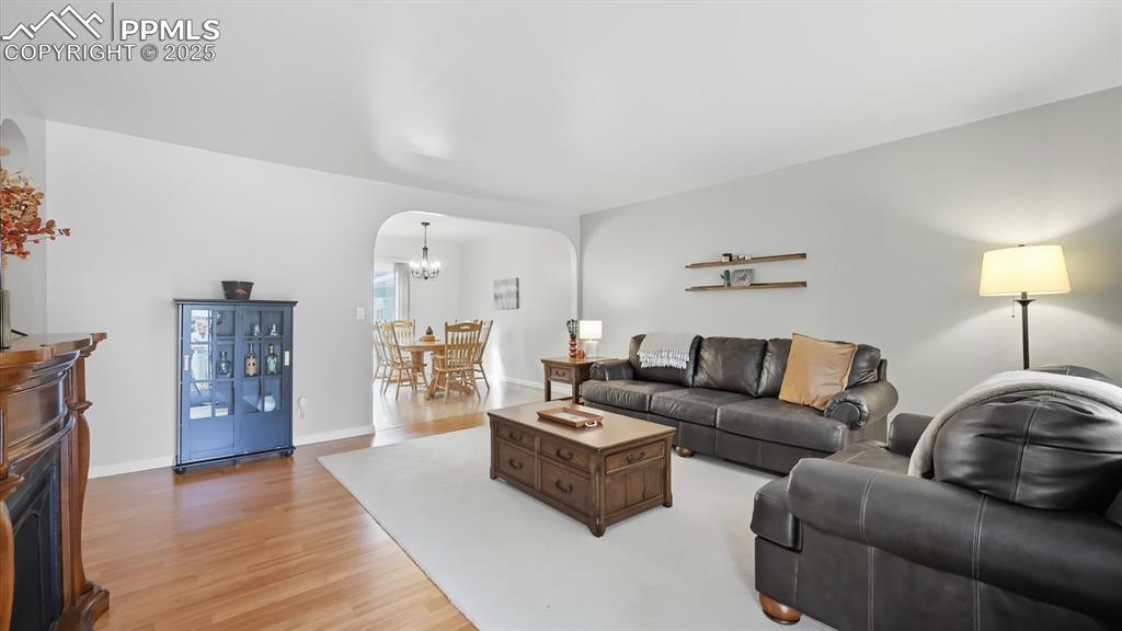 Image 12 of 34: View of the Living Room into the Dining Room.