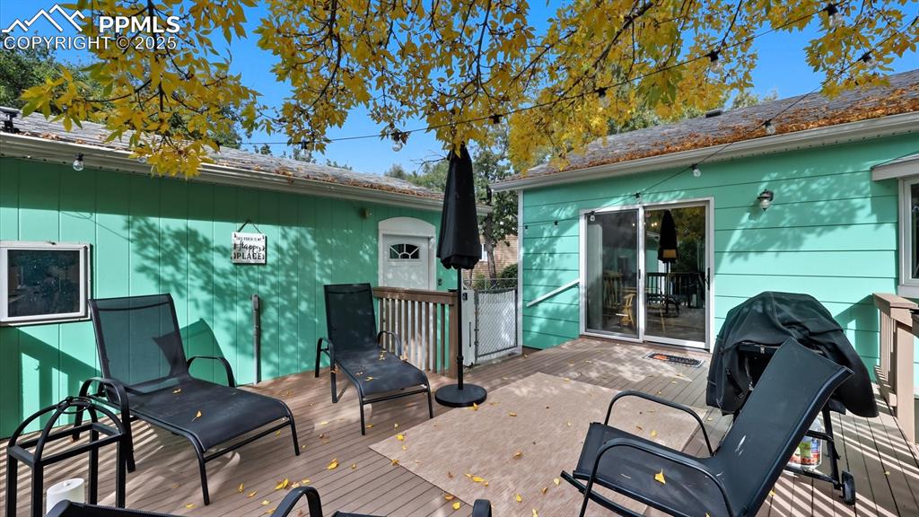 Image 14 of 34: Backyard composite deck for outdoor dining and relaxation.