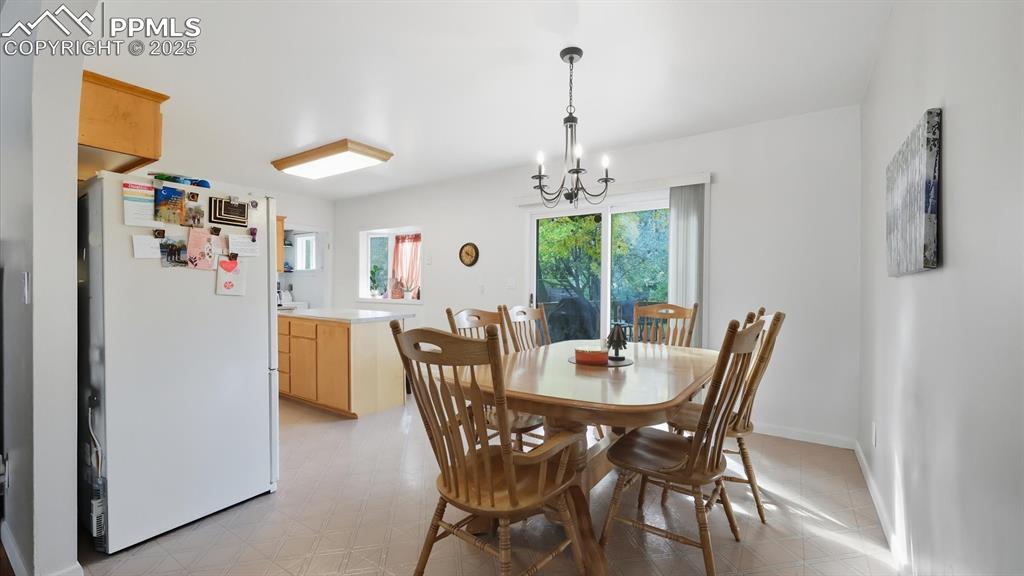 Image 16 of 34: The Dining Room flows into the Kitchen for easy food service and clean up.