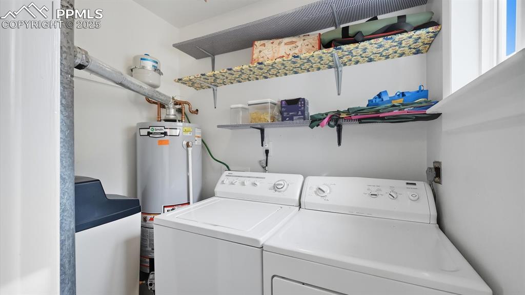 Image 19 of 34: The Laundry Rm is located off the Kitchen with washer and dryer that stay.