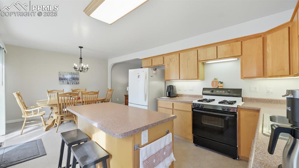 Image 20 of 34: View of the Dining Room from the Kitchen