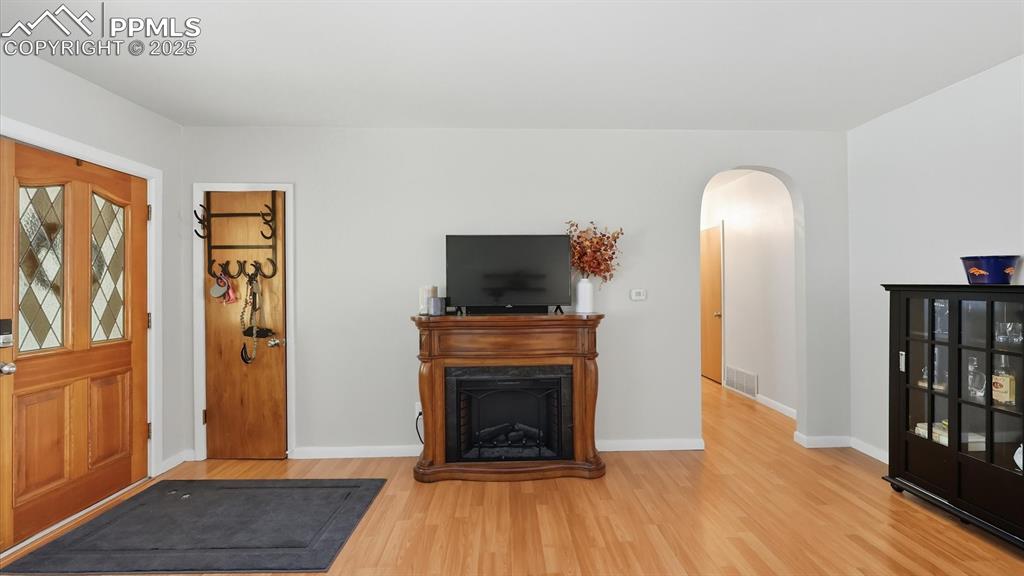 Image 21 of 34: Front Entry into the bedroom hallway.