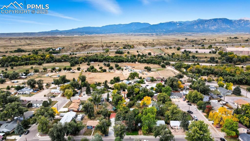 Image 34 of 34: Aerial view of neighborhood with mountain views.