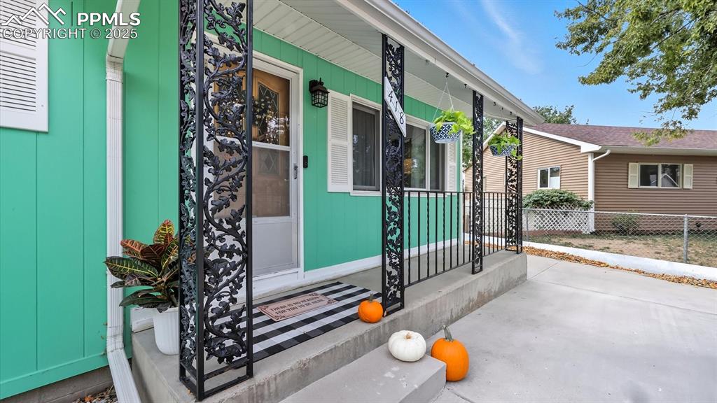 Image 7 of 34: Covered front porch to enjoy your morning coffee.