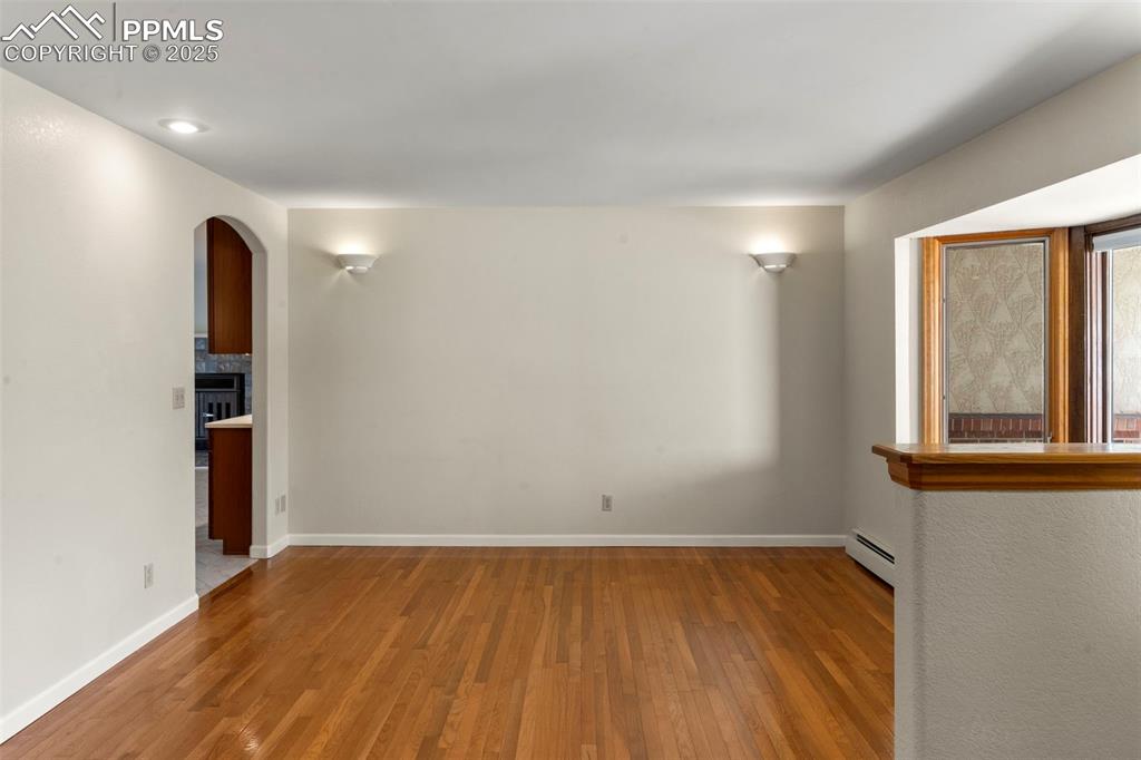 Image 11 of 26: Wood Floors and Bay Window in the Dining Area