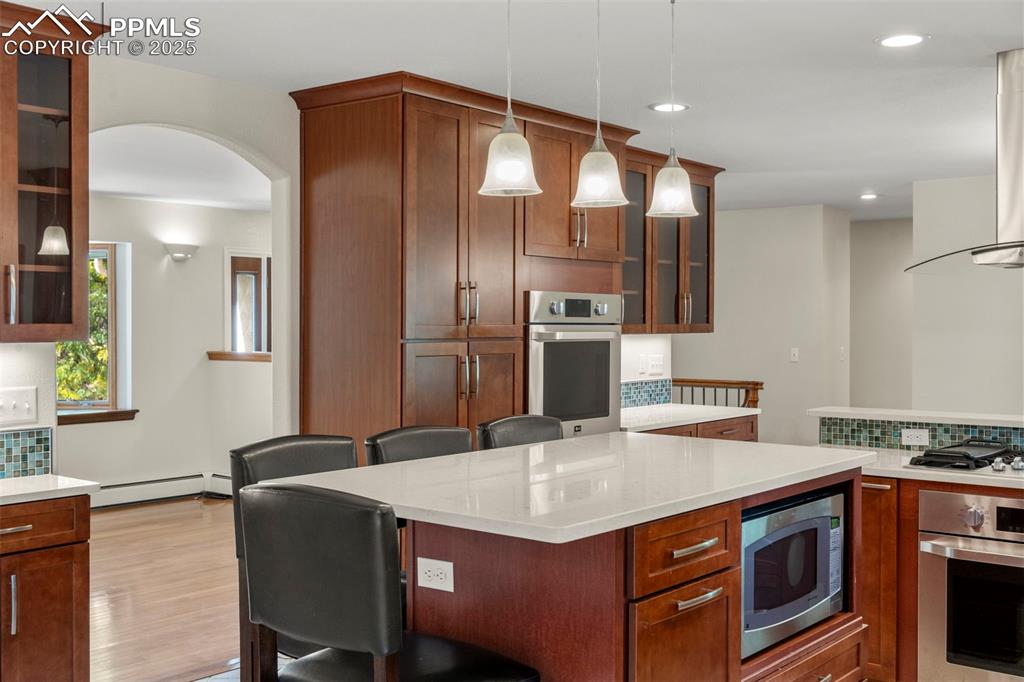 Image 7 of 26: Quartz Countertops in the Remodeled Kitchen