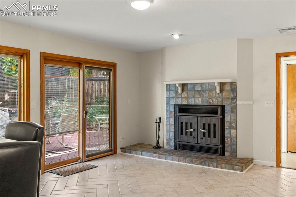Image 9 of 26: Wood Burning Fireplace in the Family Room