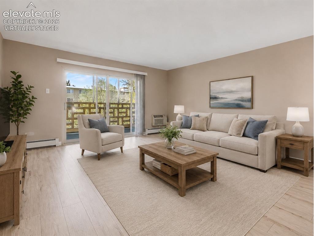 Image 10 of 50: virtually staged Living area featuring light wood-finish flooring, neutral