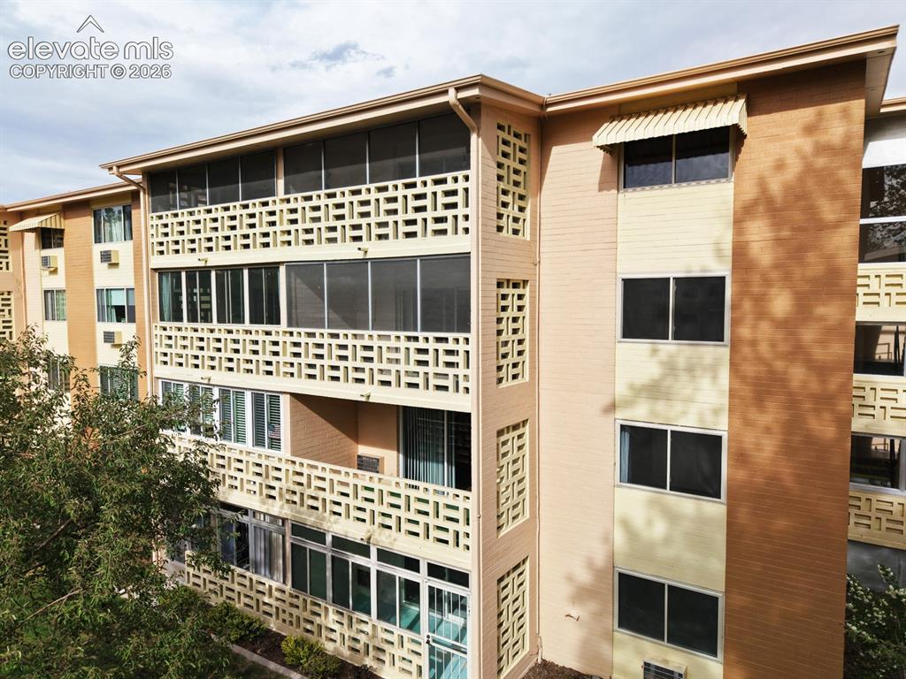 Image 32 of 50: The home is on the 3rd floor and is screened in with included roller blinds
