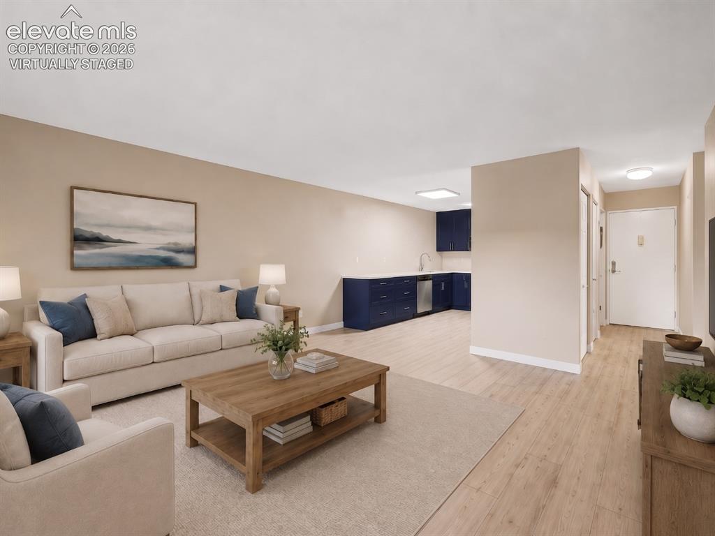 Image 8 of 50: virtually staged Open-concept living space featuring wood-finish flooring,
