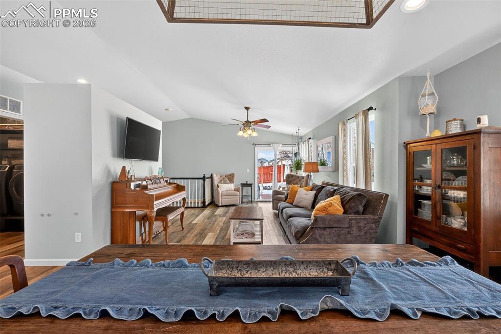 Image 14 of 47: Living area featuring hardwood / wood-style floors, recessed lighting, loft