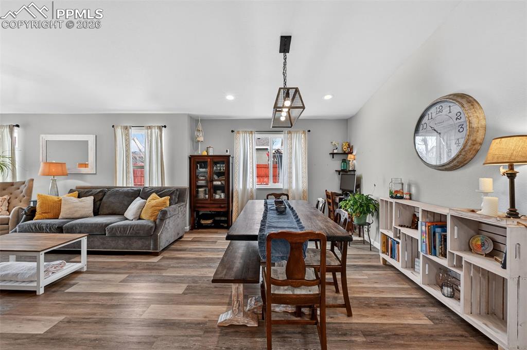 Image 16 of 47: Dining room featuring dark wood-style flooring, plenty of natural light, an