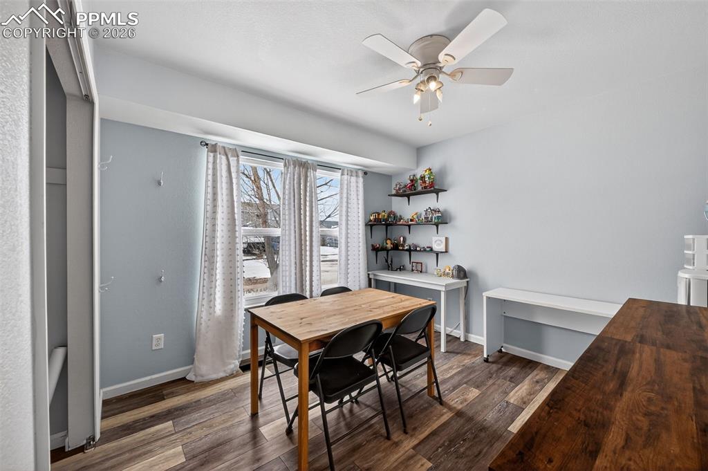 Image 31 of 47: bedroom featuring dark wood-style floors and a ceiling fan