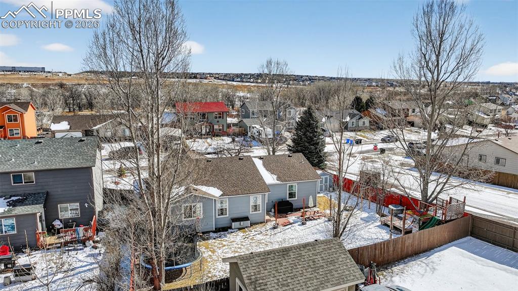 Image 45 of 47: Snowy aerial view featuring a residential view