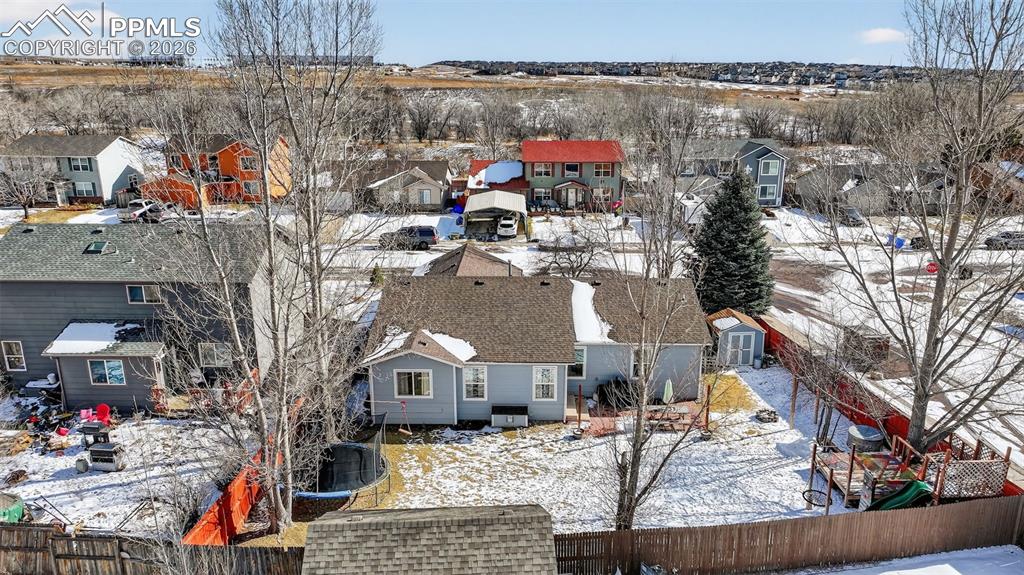 Image 47 of 47: Snowy aerial view with a residential view