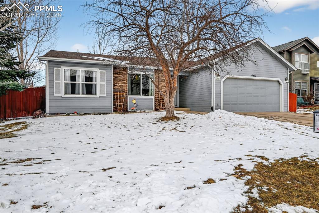 Image 5 of 47: View of front of house with a garage