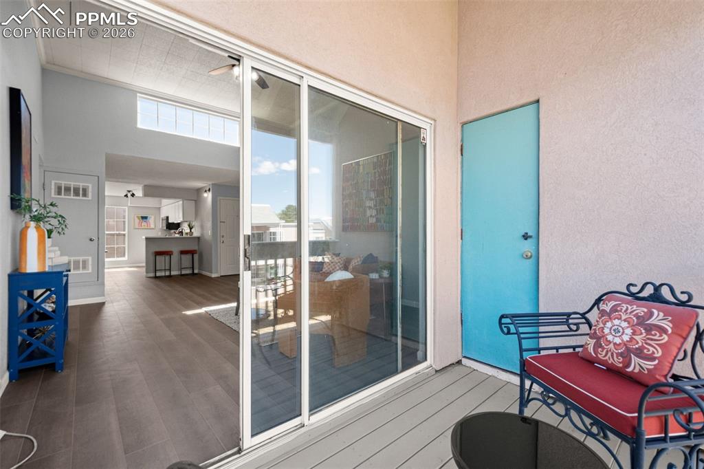 Image 26 of 27: The property features a private outdoor area with a light-colored deck and 