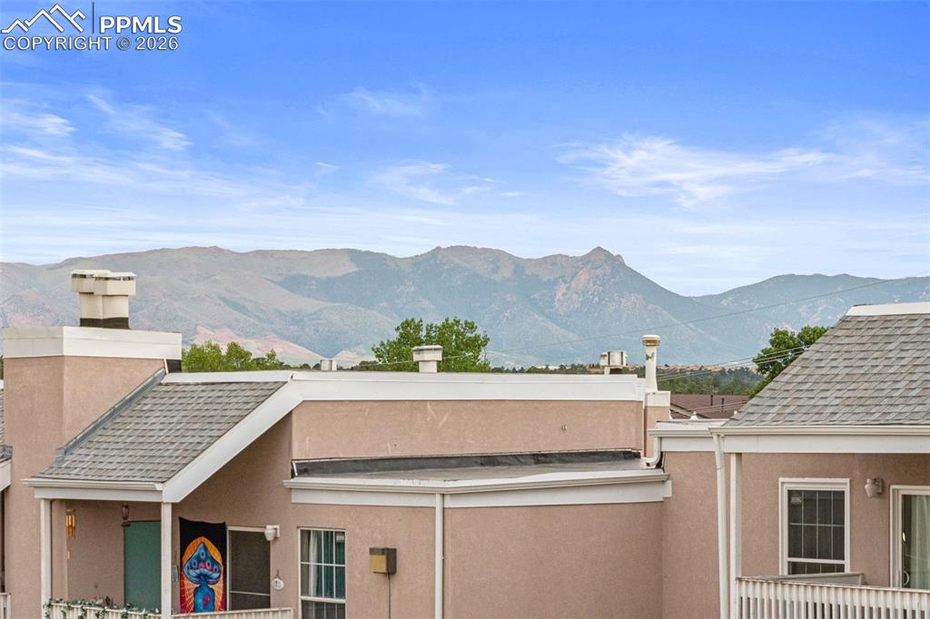 Image 5 of 27: The property offers a mountain view and features stucco exterior finishes a