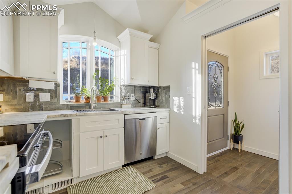 Image 14 of 35: The perfect window over the stainless steel sink.