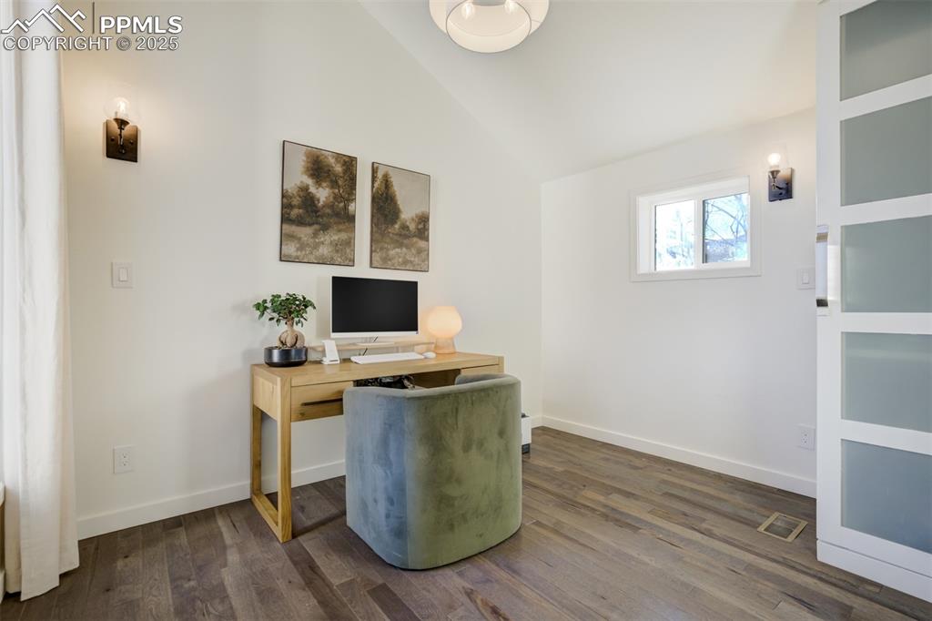 Image 19 of 35: Bedroom 2 on the main level currently being utilized as an office.