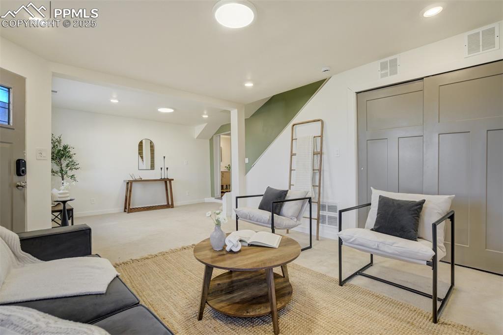 Image 21 of 35: The basement is the perfect secondary living space for family, friends & gu